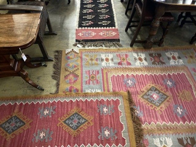 Three modern pink ground Kelim rugs, largest 200 x 155cm